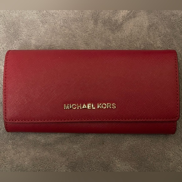Michael Kors Handbags - 🚫SOLD🚫 MICHAEL KORS LONG RED TRIFOLD WALLET / APPEARS UNUSED
